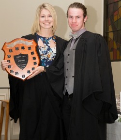 Lewis Chambers Senior Tutor presents the DC Gale Shield to Kayley Zuhorn RA Townsville whos Corridor Top Cock collective
